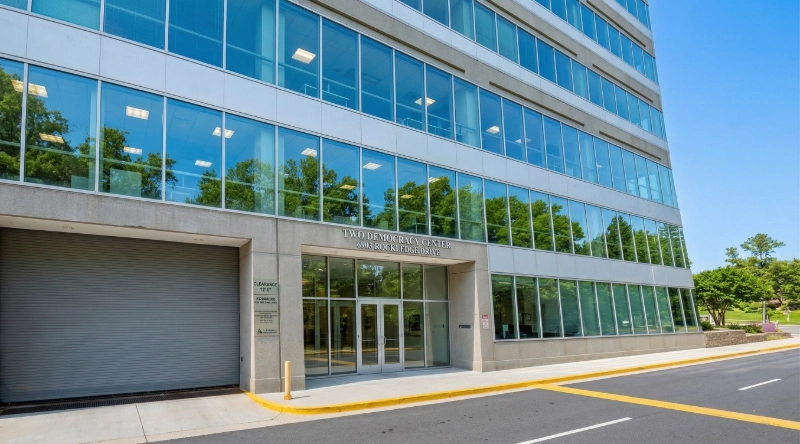Exterior view Vein Treatment Clinic a modern medical office building under a clear blue sky.