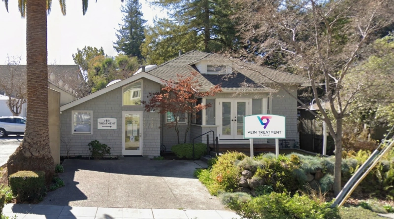 Exterior view Vein Treatment Clinic a modern medical office building under a clear blue sky.