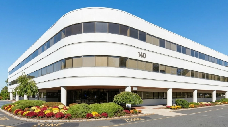 Exterior view Vein Treatment Clinic a modern medical office building under a clear blue sky.