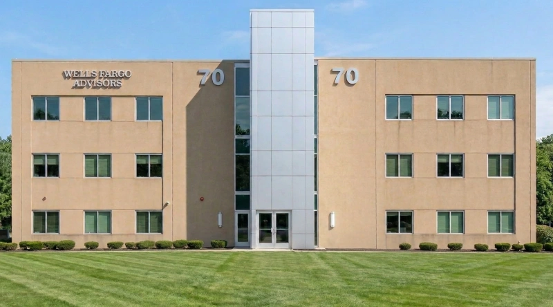 Exterior view Vein Treatment Clinic a modern medical office building under a clear blue sky.