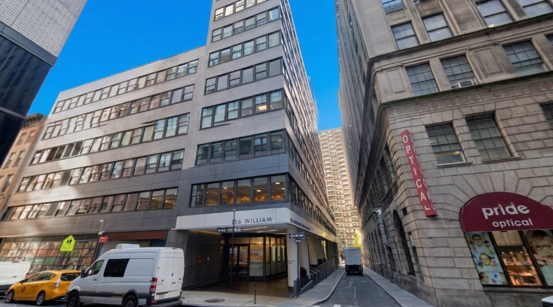 Exterior view Vein Treatment Clinic a modern medical office building under a clear blue sky.