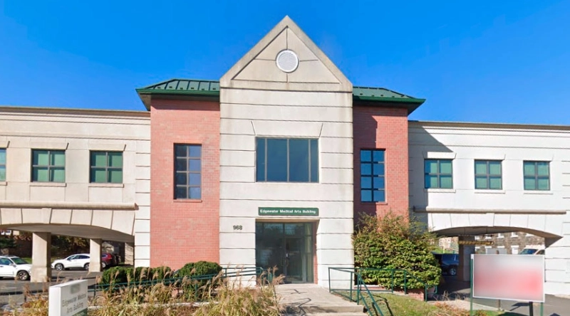 Exterior view Vein Treatment Clinic a modern medical office building under a clear blue sky.