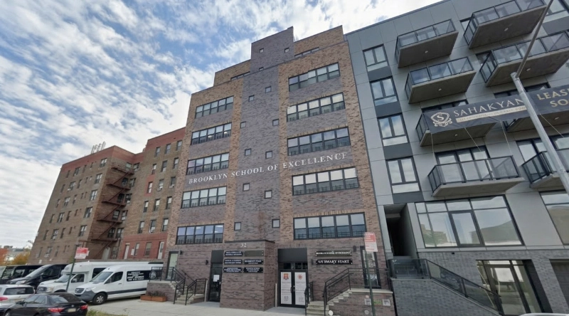 Exterior view Vein Treatment Clinic a modern medical office building under a clear blue sky.