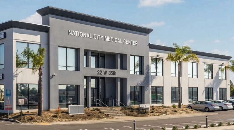 Exterior view Vein Treatment Clinic a modern medical office building under a clear blue sky.