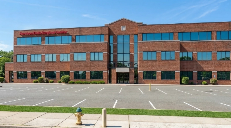 Exterior view Vein Treatment Clinic a modern medical office building under a clear blue sky.
