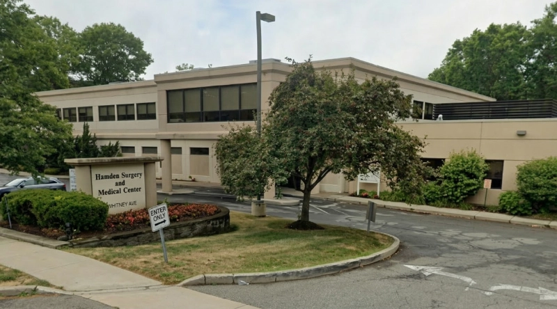 Exterior view Vein Treatment Clinic a modern medical office building under a clear blue sky.