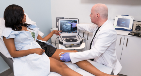 Doctor performing ultrasound photo