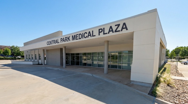 Exterior view Vein Treatment Clinic a modern medical office building under a clear blue sky.