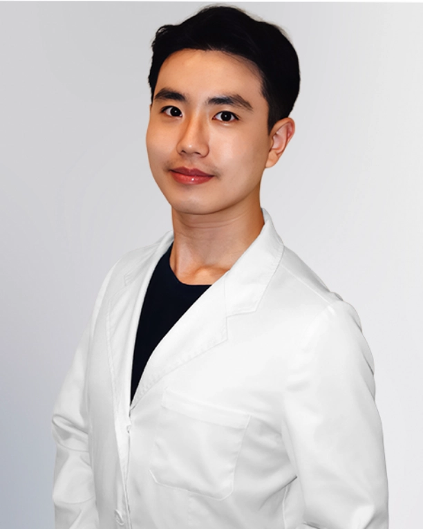 A professional portrait of a Physician Assistant at Vein Treatment Clinic. She is wearing a white medical coat and standing with her arms crossed, representing the expert and compassionate clinical team dedicated to patient care and pain relief.