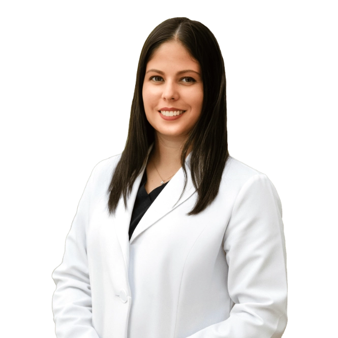 A professional portrait of a Physician Assistant at Vein Treatment Clinic. She is wearing a white medical coat and standing with her arms crossed, representing the expert and compassionate clinical team dedicated to patient care and pain relief.
