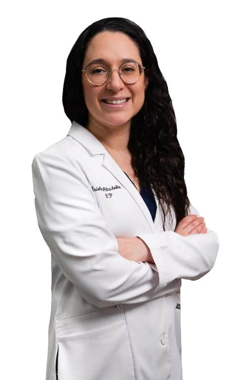 A professional portrait of a Physician Assistant at Vein Treatment Clinic. She is wearing a white medical coat and standing with her arms crossed, representing the expert and compassionate clinical team dedicated to patient care and pain relief.