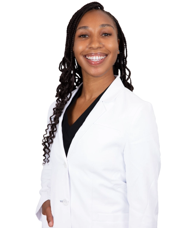 A professional portrait of a Physician Assistant at Vein Treatment Clinic. She is wearing a white medical coat and standing with her arms crossed, representing the expert and compassionate clinical team dedicated to patient care and pain relief.