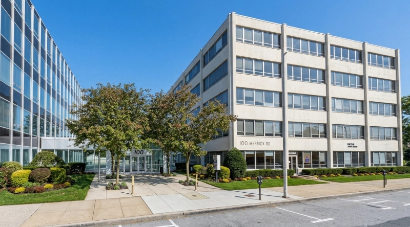 Exterior view Vein Treatment Clinic a modern medical office building under a clear blue sky.