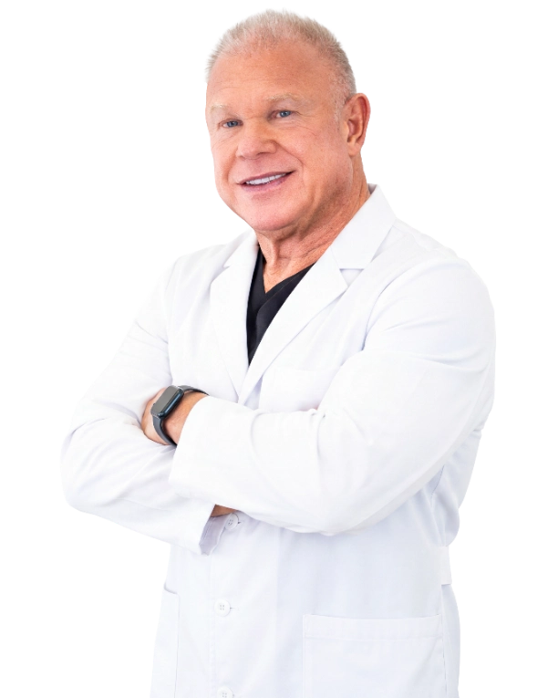Professional headshot of Dr. David Stone, MD, a healthcare provider wearing a white lab coat over a black shirt, smiling at the camera with arms crossed in a confident, professional pose. The image features a black background and is a standard clinical portrait appropriate for medical practice representation.