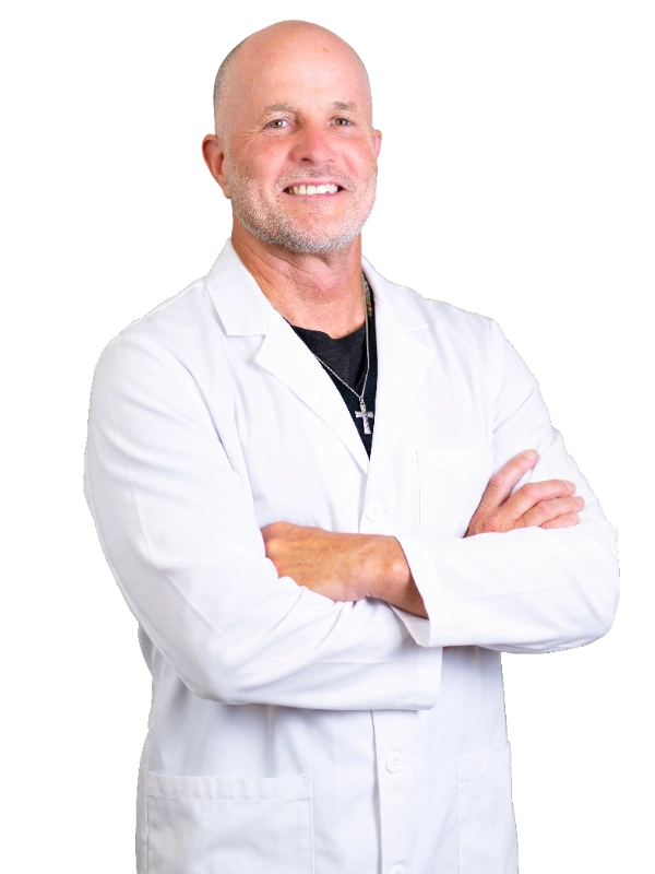 Professional headshot of Dr. Robert McWhirter wearing a white lab coat, smiling at the camera against a neutral background. This is a standard medical professional portrait used for clinic or practice identification.